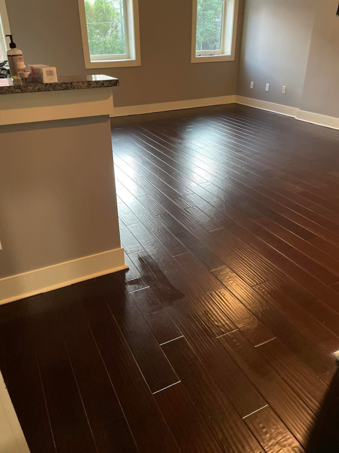 Empty room with freshly cleaned wood floors