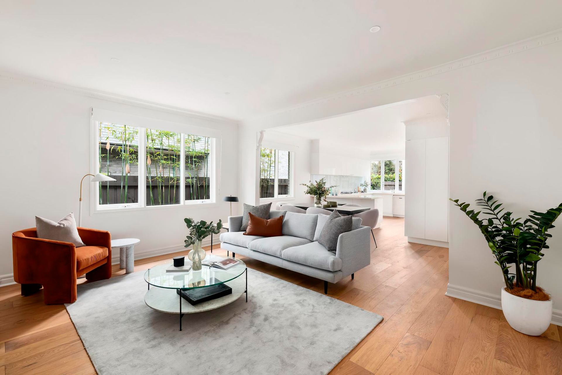 Cleaner dusting a living room