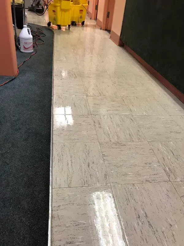 Freshly cleaned shiny tiled hallway floor
